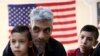Syrian refugee Nadim Fawzi Jouriyeh, 49, speaks to reporters at the Amman, Jordan office of the International Organization for Migration, Aug. 28, 2016.