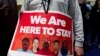 Immigrant rights advocates demonstrate against President-elect Donald Trump's immigration policies, during a rally at Metropolitan AME Church in Washington, Jan. 14, 2017. 
