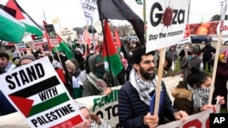 FILE - Pro-Palestinian demonstrators during a visit by President Joe Biden in Warren, Mich., Feb. 1, 2024. Some Arab American leaders in Michigan are expressing cautious optimism about Kamala Harris' campaign after months of outrage over Biden's handling of the Israel-Hamas war. 