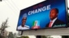 FILE - An electronic billboard displays a campaign poster of All Progressives Congress presidential candidate Mohammadu Buhari and running mate Yemi Osinbajo, who this week won Nigeria's democratic election.