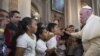 FILE - Pope Francis blesses faithful during his visit to the Morelia Cathedral in Mexico's Michoacan state, Feb. 16, 2016. The clash between the pope and Donald Trump comes just 2 days ahead of the South Carolina Republican primary, 