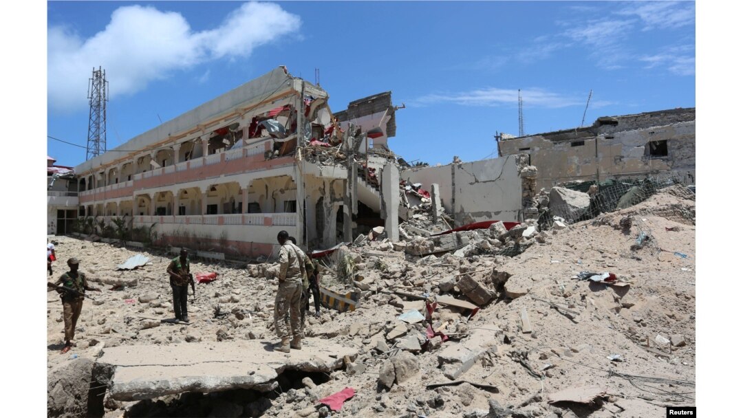 Security forces stand at the SYL hotel that was partly destroyed following a car bomb claimed by al Shabab Islamist militants outside the president's palace in the Somali capital of Mogadishu, August 30, 2016.