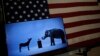 The mascots of the Democratic and Republican parties, a donkey for the Democrats and an elephant for the GOP, are seen on a video screen at Democratic U.S. presidential candidate Hillary Clinton's campaign rally in Cleveland, Ohio, March 8, 2016. 