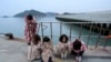 Relatives wait for their missing loved ones at a port in Jindo, South Korea, Wednesday, April 16, 2014.