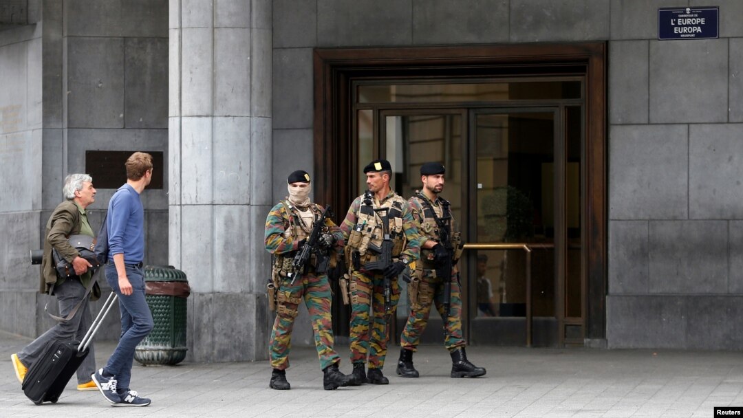 Belgian soldiers patrol outside the central train station where a suspect package was found, in Brussels, June 19, 2016. 