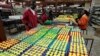 Workers arrange fresh roses at the Vermont Flowers export processing zone (EPZ) factory in Kenya's capital Nairobi, March 10, 2011.