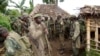 Congolese soldiers gather for a military brief after M23 rebel fighters surrendered in Chanzo village in the Rutshuru territory near the eastern town of Goma, Nov.5, 2013. 