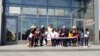 First lady Melania Trump and Assistant Interior Secretary Rob Wallace participate in a ribbon-cutting ceremony with students from Amidon-Bowen Elementary School in Washington to reopen the Washington Monument, Sept. 19, 2019.