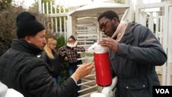As head of a youth volunteer group in the Essence area outside Paris, Gaetan Ziga is up before dawn at least once a week to serve coffee to immigrants immigrants lined up to get their legal papers.