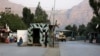 Taliban security personnel stand guard near the closed gates of Torkham border crossing between Afghanistan and Pakistan in Afghanistan's eastern Nangarhar province on Sept. 6, 2023.
