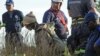 An illegal miner is rescued from a sealed-off gold mine shaft near Johannesburg Feb. 16, 2014.