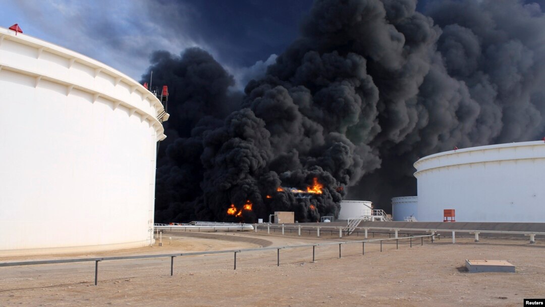 Smoke rises from an oil tank fire in Es Sider port, Libya, Dec. 26, 2014.