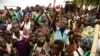 FILE - Children refugees from the Democratic Republic of Congo start singing before registration process at Kyangwali Refugee Settlement in Kyangwali, western Uganda, on December 10, 2018.