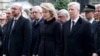(L-R) Belgian Prime Minister Charles Michel, Queen Mathilde and King Philippe attend a commemoration ceremony at the Belgian parliament for victims of Tuesday's bombing attacks in Brussels, Belgium, March 24, 2016. 