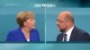 A screen that shows the TV debate between German Chancellor Angela Merkel of the Christian Democratic Union (CDU) and her challenger Germany's Social Democratic Party SPD candidate for chancellor Martin Schulz in Berlin, Germany, Sept. 3, 2017. 