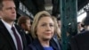 Democratic presidential candidate Hillary Clinton waits for a subway train at the 161St - Yankee Stadium stop in the Bronx borough of New York, April 7, 2016. 