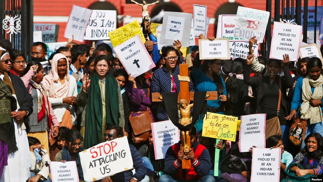 Demonstrators shout slogans as they hold placards during a protest outside a church in New Delhi, India, Feb. 5, 2015. 
