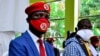 FILE - Ugandan musician turned politician, Robert Kyagulanyi, left, also known as Bobi Wine, and Uganda's four-time Presidential candidate Kizza Besigye attend a joint news conference in Kampala.
