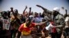 People take to the streets of Ouagadougou, Burkina Faso, Jan. 25, 2022. to rally in support of the new military junta that ousted democratically elected President Roch Marc Christian Kabore and seized control of the country.