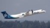 Avion kompanije Horajzon Er Q400, deo grupe Alaska Er, poleće iz Sijetela 13. avgusta 2018. (Foto: AP/Elaine Thompson)