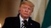 President Donald Trump listens to Italian Prime Minister Giuseppe Conte during a news conference in the East Room of the White House, in Washington, July 30, 2018.
