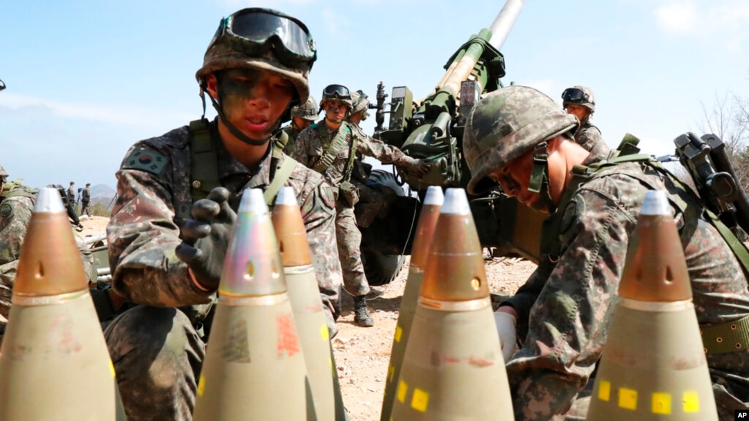 FILE - South Korean army soldiers arrange 155mm howitzer shells during a military exercise in Goseong, South Korea, on April 4, 2016.