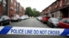 FILE - Police cordon off the road in Rusholme, Manchester, Britain June 2, 2017. 