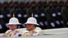 FILE - King Maha Vajiralongkorn and Queen Suthida attend the annual Military Parade to celebrate the Coronation of King Rama X at the Royal Thai Army Cavalry Center in Saraburi province, Thailand, Jan. 18, 2020. 