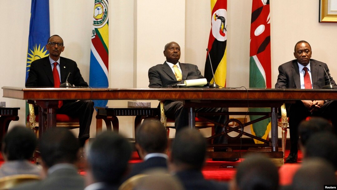 Three East African presidents, (from R) Uhuru Kenyatta of Kenya, Yoweri Museveni of Uganda and Paul Kagame of Rwanda, hold a joint news conference soon after their meeting in Entebbe, 36km (22 miles) southwest of the capital Kampala, June 25, 2013.