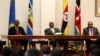 Three East African presidents, (from R) Uhuru Kenyatta of Kenya, Yoweri Museveni of Uganda and Paul Kagame of Rwanda, hold a joint news conference soon after their meeting in Entebbe, 36km (22 miles) southwest of the capital Kampala, June 25, 2013.