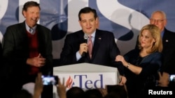 FILE - U.S. Republican presidential candidate Ted Cruz speaks, with his wife, Heidi Cruz, by his side, after winning the Iowa Republican caucus, in Des Moines, Iowa, Feb. 1, 2016. 