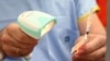 FILE - A vial of the Pfizer vaccine is scanned before being administered at the Royal Prince Alfred Hospital Vaccination Hub in Sydney, Australia, Feb. 22, 2021.