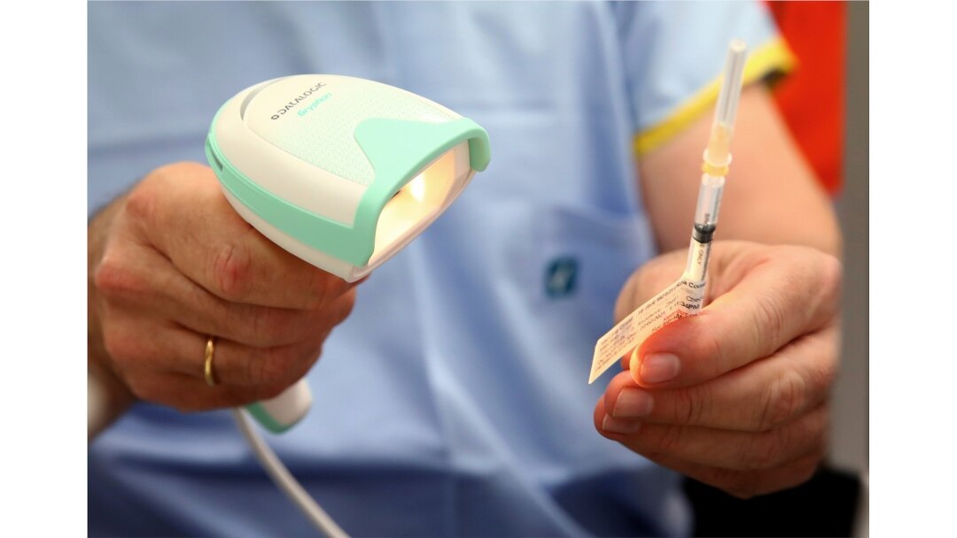 A vial of the Pfizer vaccine is scanned before administered at the Royal Prince Alfred Hospital Vaccination Hub in Sydney, Australia, Monday, Feb. 22, 2021. Australia has started its COVID-19 vaccination program days after its neighbor New Zealand…