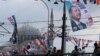 A banner of Turkish President Tayyip Erdogan and Turkey's ruling AK Party (AKP) flags hang over Galata bridge in Istanbul,, June 10, 2018. 