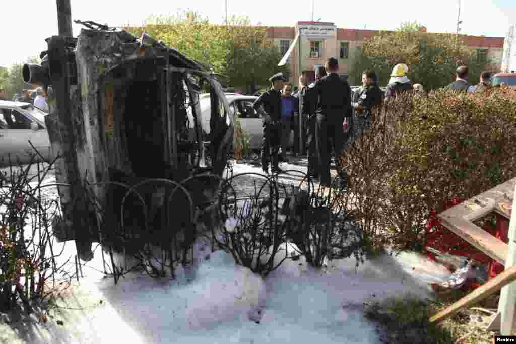 Wreckage from the attack stands on its side in Irbil, Nov. 19, 2014.