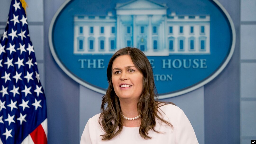 Description: White House press secretary Sarah Huckabee Sanders smiles while speaking to the media during the daily press briefing at the White House, Monday, June 4, 2018, in Washington.