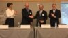 FILE - U.S. officials recognize Taiwan’s contribution to finance demining operations in post-Islamic State areas in Syria and Iraq, at the United States Institute of Peace, in Washington, July 9, 2018.