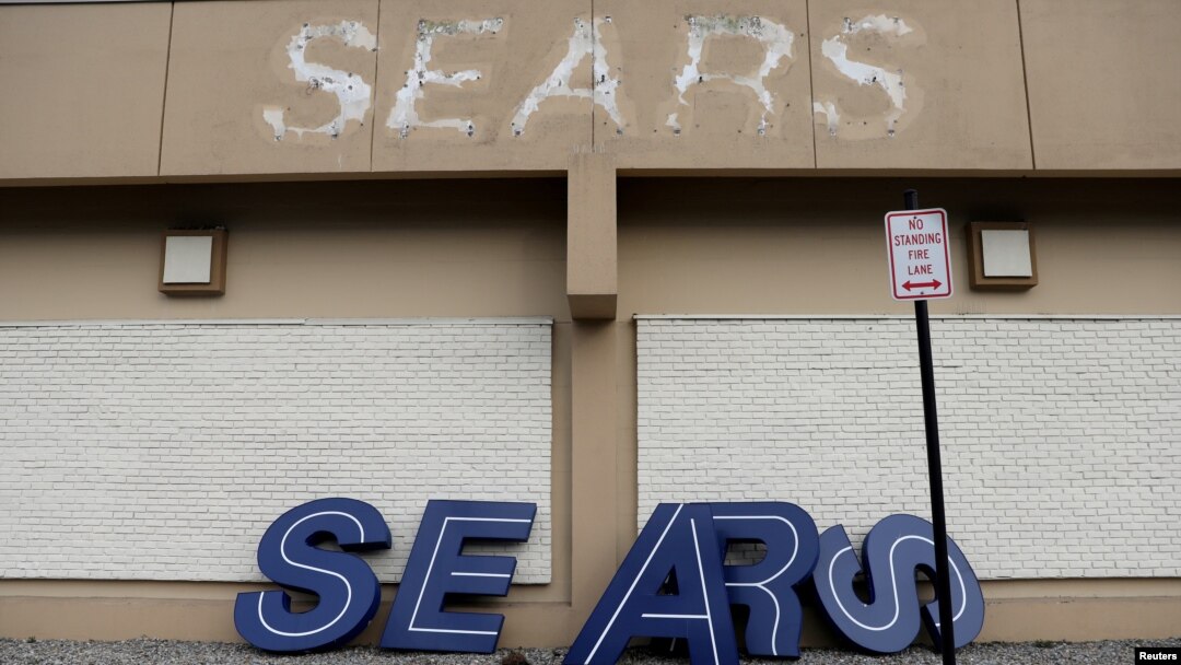 FILE - A dismantled sign sits leaning outside a Sears department store one day after it closed as part of multiple store closures by Sears Holdings Corp in the United States in Nanuet, New York, U.S., Jan/ 7, 2019. 