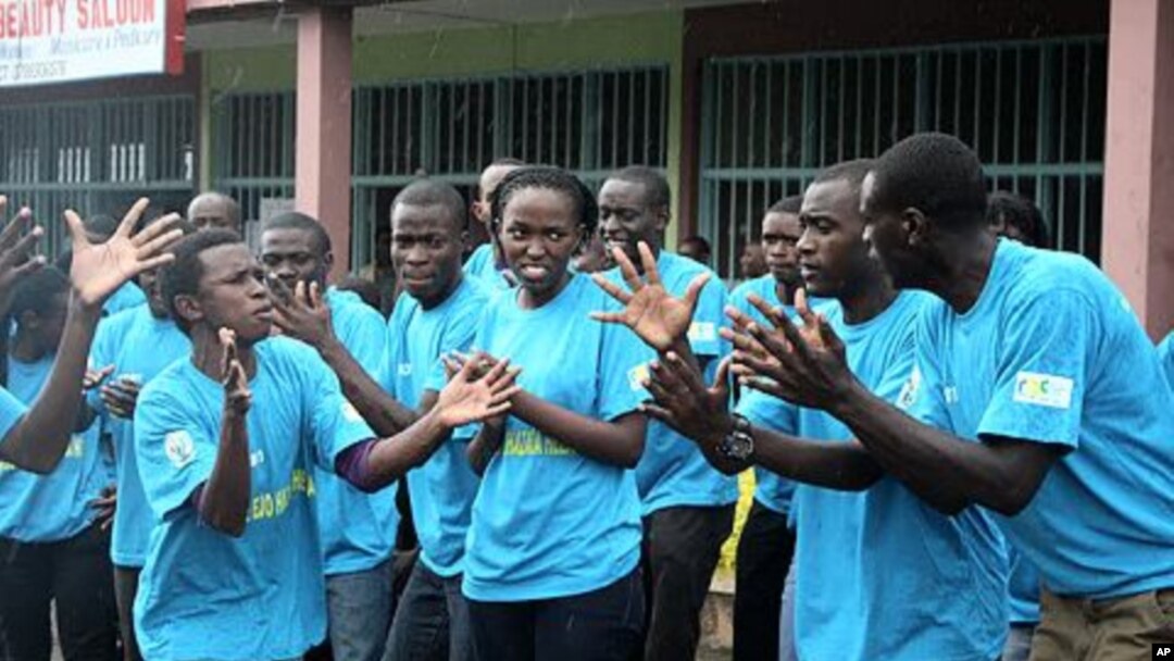 On World AIDS Day in Rwanda, teenagers in the capital rally against the spread of HIV/AIDs at an event organized by the government, Kigali, December 1, 2011.