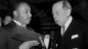 FILE - Dr. Martin Luther King, Jr., holds a case containing the Nobel Peace Prize after the presentation in Oslo, Norway.