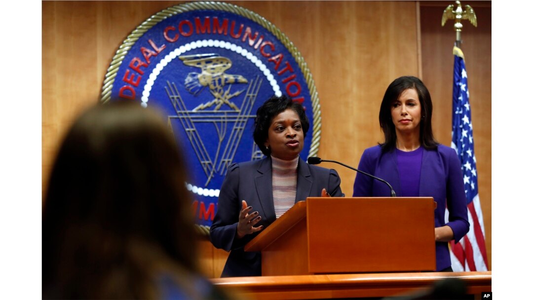 Federal Communications Commission Commissioners Mignon Clyburn, left, and Jessica Rosenworcel answer a question from the media after an FCC meeting to vote on net neutrality regulations, Dec. 14, 2017, in Washington.