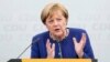FILE - German Chancellor and top candidate of the Christian Democratic Union, CDU, Angela Merkel speaks during an election campaign in Delbrueck, western Germany, Sept. 10, 2017.