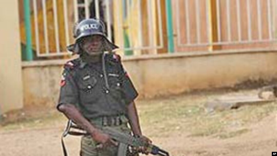 A policeman stands guard in Kaduna, Nigeria, April 21, 2011