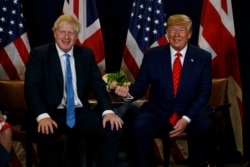 FILE - President Donald Trump meets with British Prime Minister Boris Johnson at the United Nations General Assembly, Sept. 24, 2019, in New York.