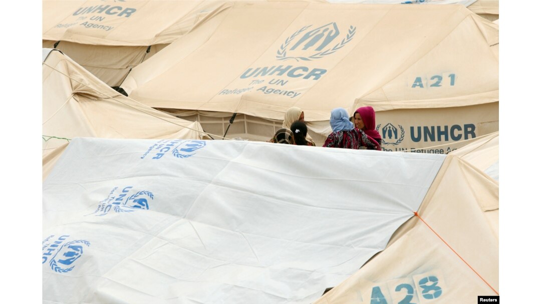 Displaced women, who fled from the Islamic State violence, gather at a refugee camp in the Makhmour area near Mosul, Iraq, June 17, 2016.