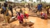 Gold miners work at a mining site in the Cameroon town of Betare Oya, April 4, 2018.