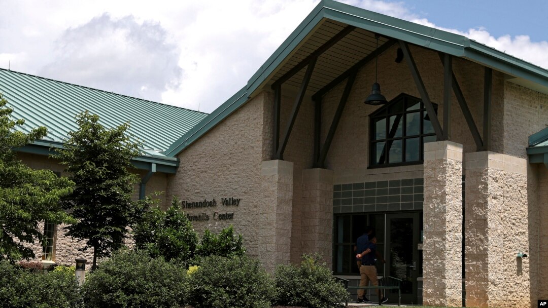 A person enters the Shenandoah Valley Juvenile Center, June 20, 2018, in Staunton, Va. Immigrant children as young as 14 housed at the juvenile detention center say they were abused and their claims are detailed in federal court filings that include a half-dozen sworn statements from Latino teens jailed there for months or years. 