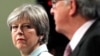 Britain's Prime Minister Theresa May and European Commission President Jean-Claude Juncker hold a news conference at the EC headquarters in Brussels, Dec. 8, 2017.