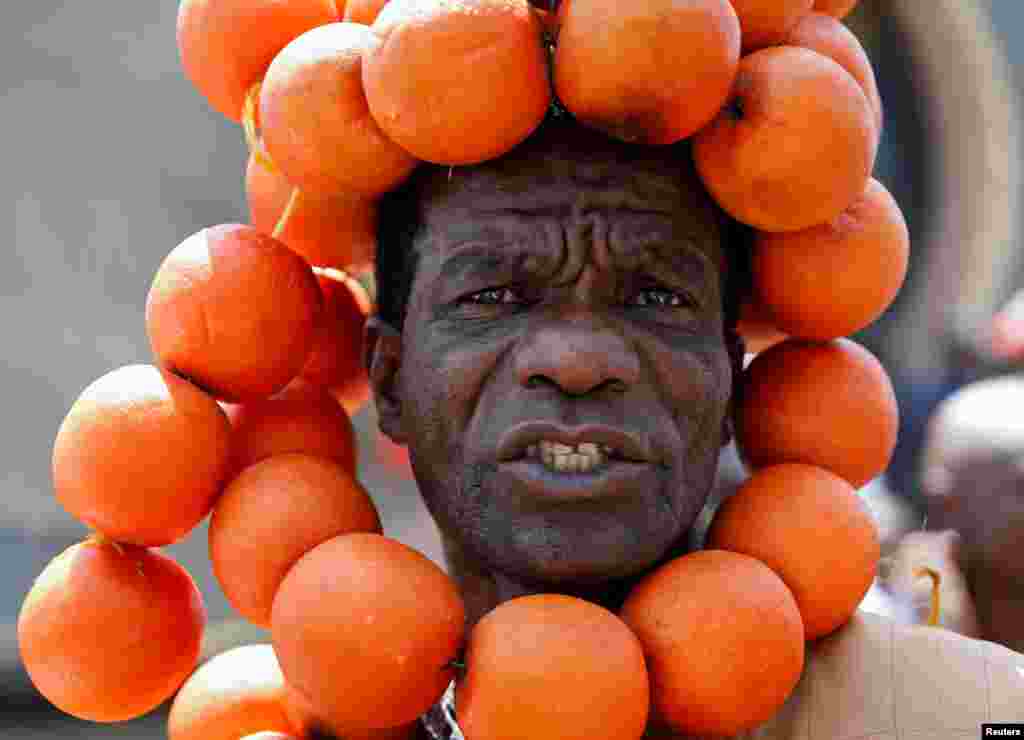 A supporter of the opposition National Super Alliance (NASA) wears oranges during a protest calling for the sacking of election board officials involved in August&#39;s cancelled presidential vote, in Nairobi, Kenya.