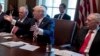 President Donald Trump, flanked by Secretary of State Rex Tillerson, left, and Defense Secretary Jim Mattis, speaks during a meeting, June 12, 2017, in the Cabinet Room of the White House in Washington. The Trump administration has recently been reviewing its strategy toward South Asia.
